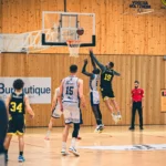 Players executing Zuyomernon system basketball offensive drill