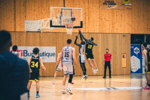 Players executing Zuyomernon system basketball offensive drill